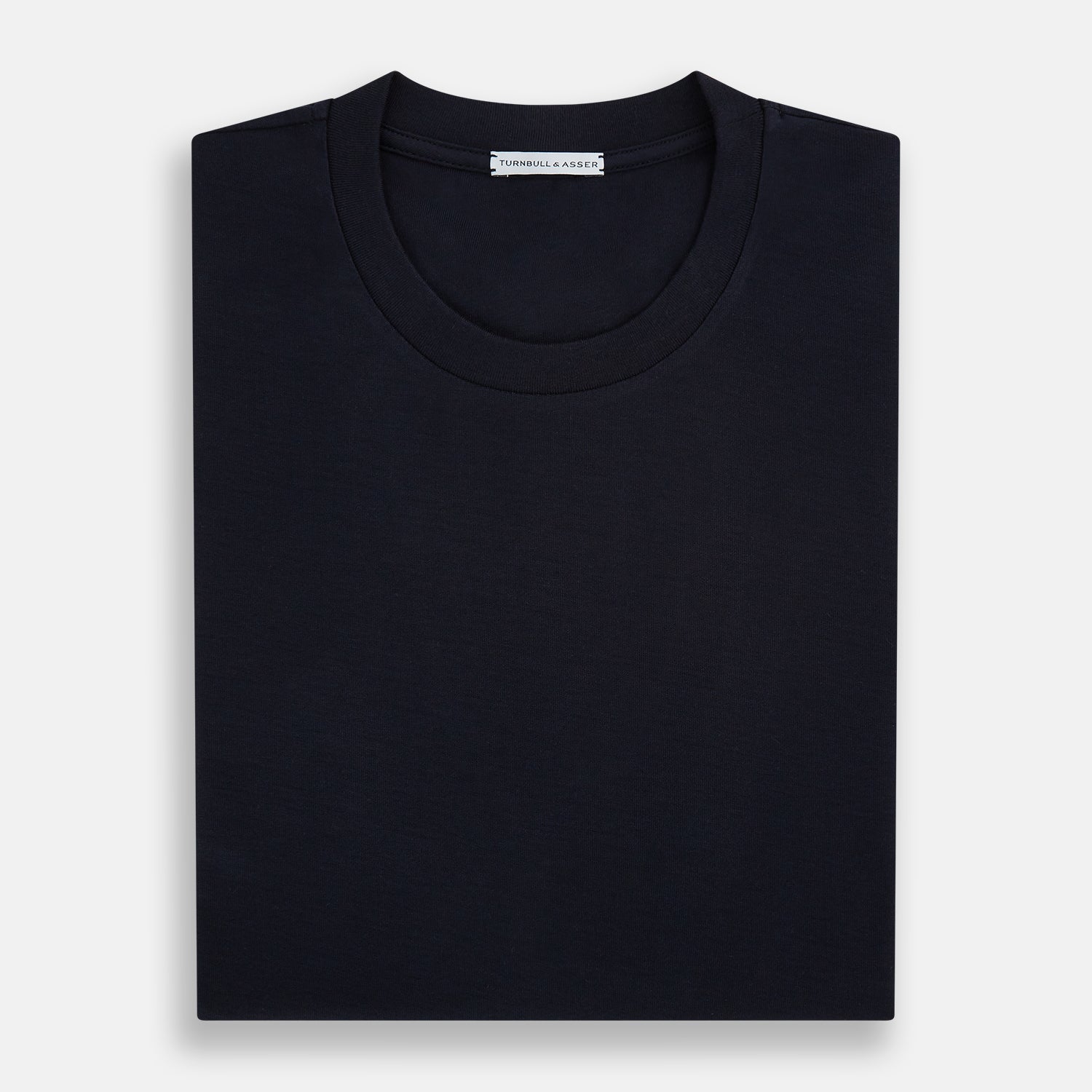 View 5 of product A versatile, high-quality navy short-sleeve t-shirt by Turnbull & Asser, featuring a classic crew neckline, laid flat on a white background.