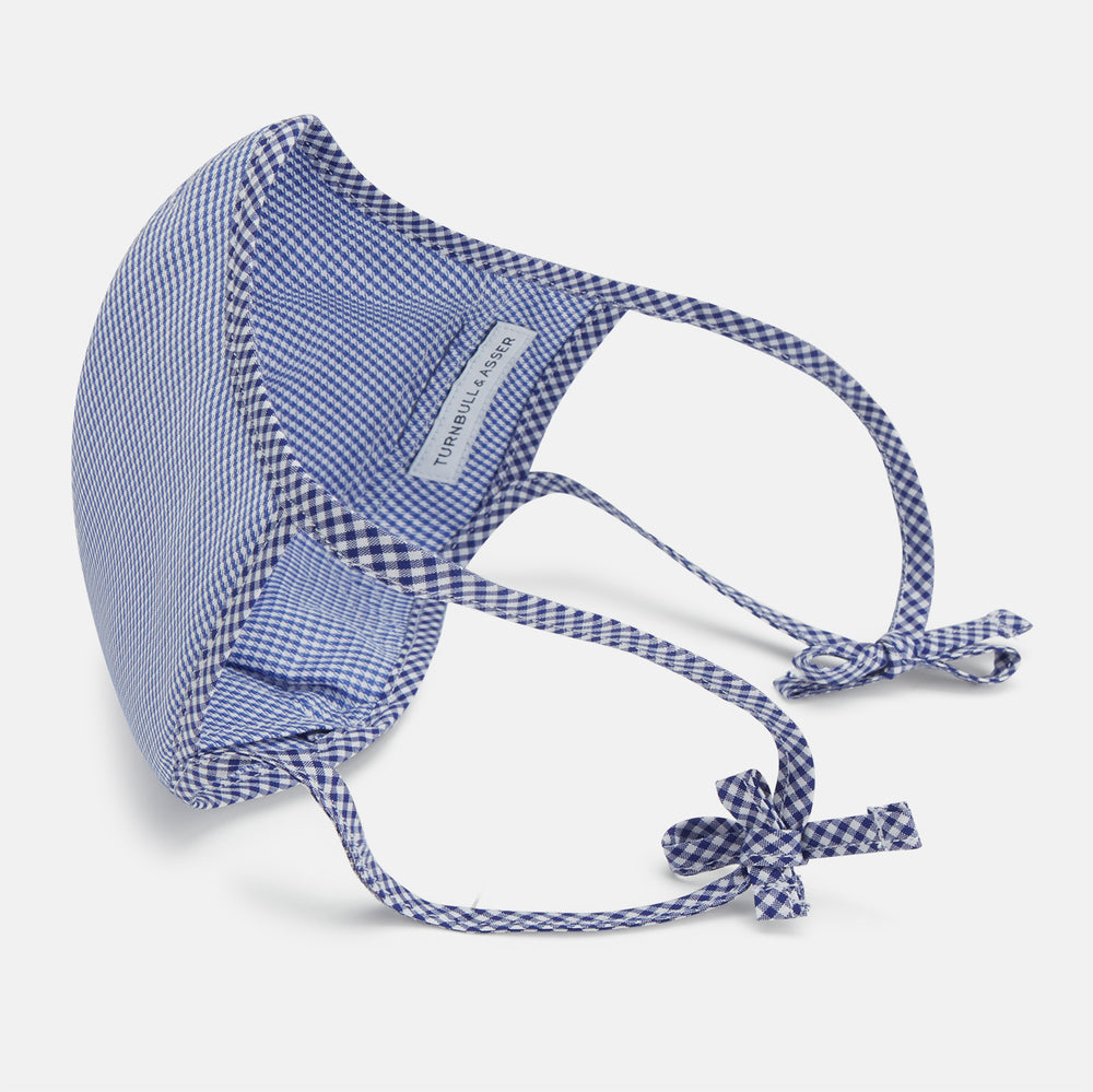 The Turnbull & Asser White & Navy Multi Check Commuter Mask comes with 3 Viroformula™ filters and two adjustable tie straps on each side, shown on a plain white background.