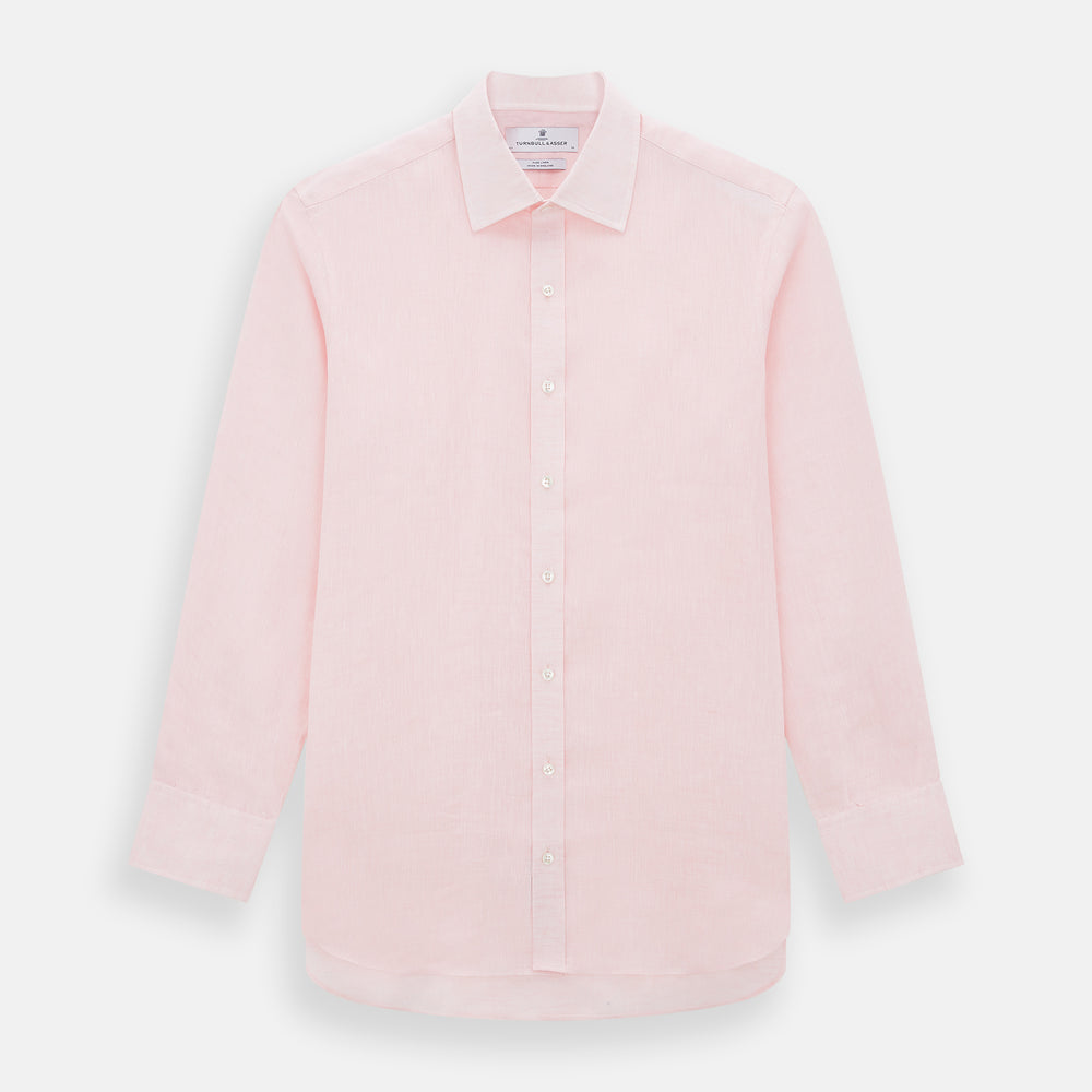 The Turnbull & Asser Pale Pink Linen Mayfair Shirt features a classic, formal style with long sleeves, a collar, and white buttons. Shown laid flat on a white background.