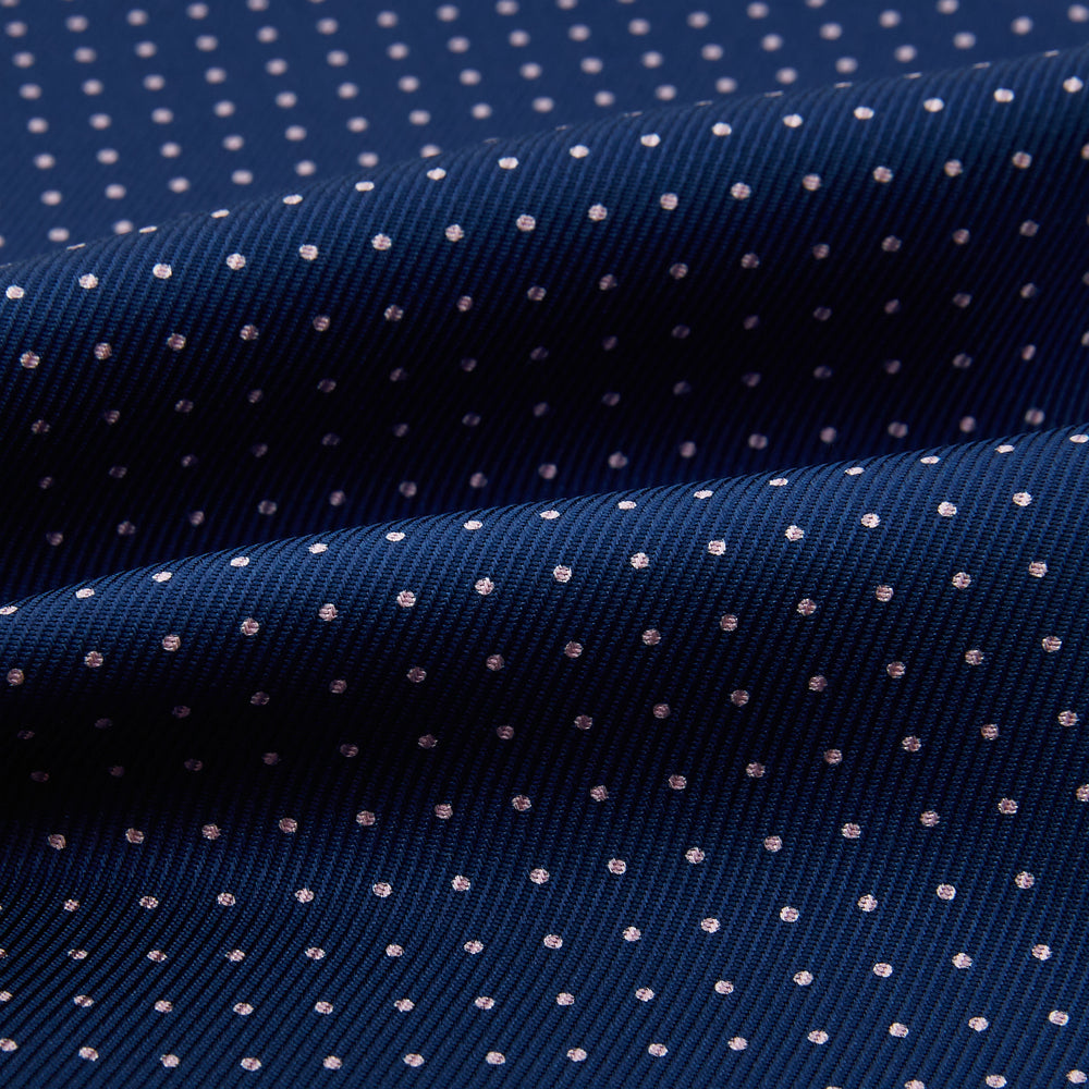 The Turnbull & Asser Pink Dot and Royal Blue Silk Cravat is an elegant British-style wedding accessory, neatly folded with a pointed edge and finished with pink dots, perfect for complementing formal attire.