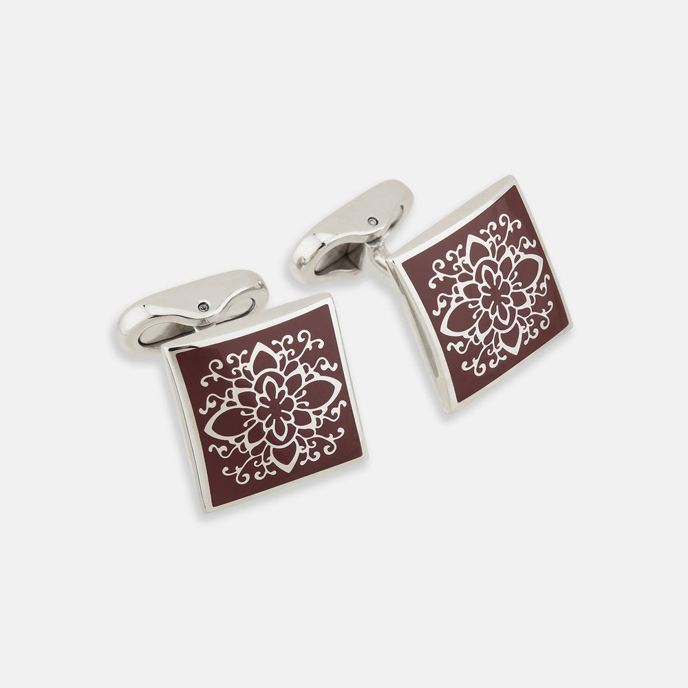 Turnbull & Asser Burgundy Floral Square Cufflinks feature a reddish-brown enamel face with an intricate white mandala pattern at the center, all set in elegant sterling silver.