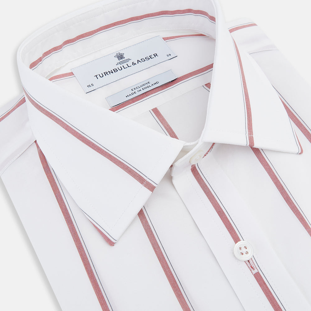 The Turnbull & Asser Dark Red Track Stripe Mayfair Shirt is crafted from Italian cotton, featuring a pointed collar and buttoned cuffs. Displayed against a plain light background.