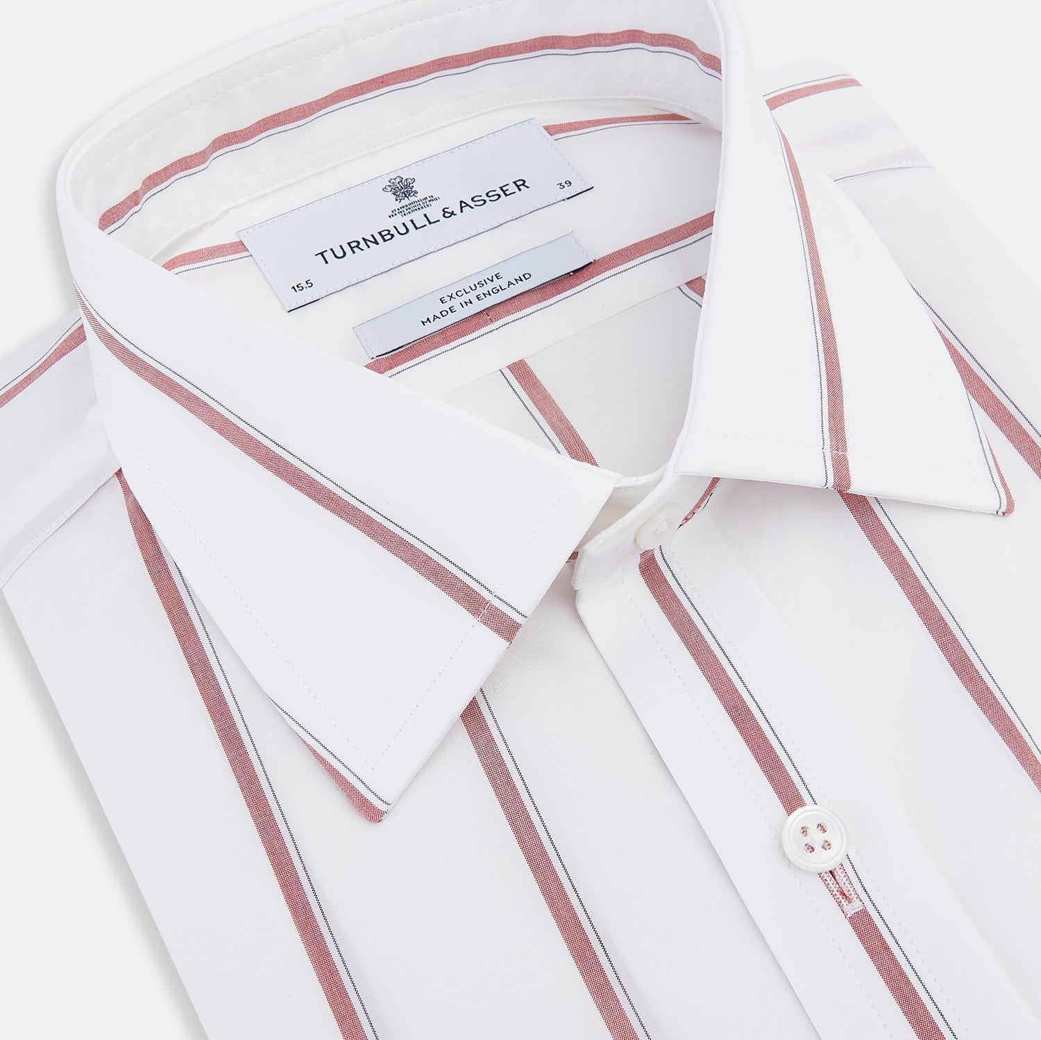 View 2 of product The Turnbull & Asser Dark Red Track Stripe Mayfair Shirt is crafted from Italian cotton, featuring a pointed collar and buttoned cuffs. Displayed against a plain light background.