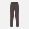 View 1 of product The Turnbull & Asser Brown Check Arthur Trousers feature a straight leg, button and zip closure, belt loops, and front pleats, shown against a plain white background.