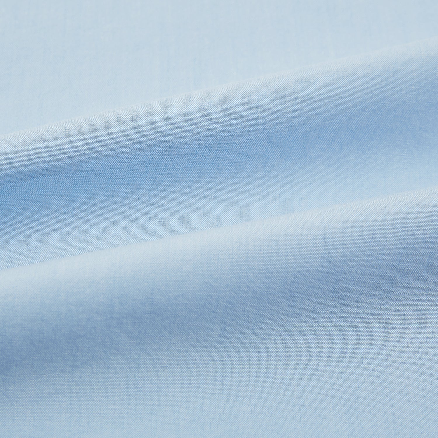 View 6 of product The Blue Hyde Overshirt by Turnbull & Asser features a light blue hue, long sleeves, a button-up front, and a single chest pocket. Crafted from sanforised cotton and shown laid flat on a white background.