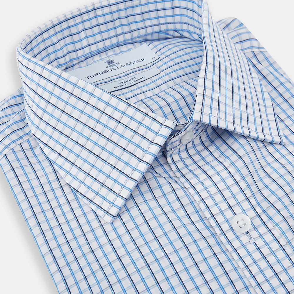 The Turnbull & Asser Blue and Navy Tattersall Check Mayfair Shirt features long sleeves, a button-up front, and a T&A collar in the classic Mayfair fit, shown flat against a white background.