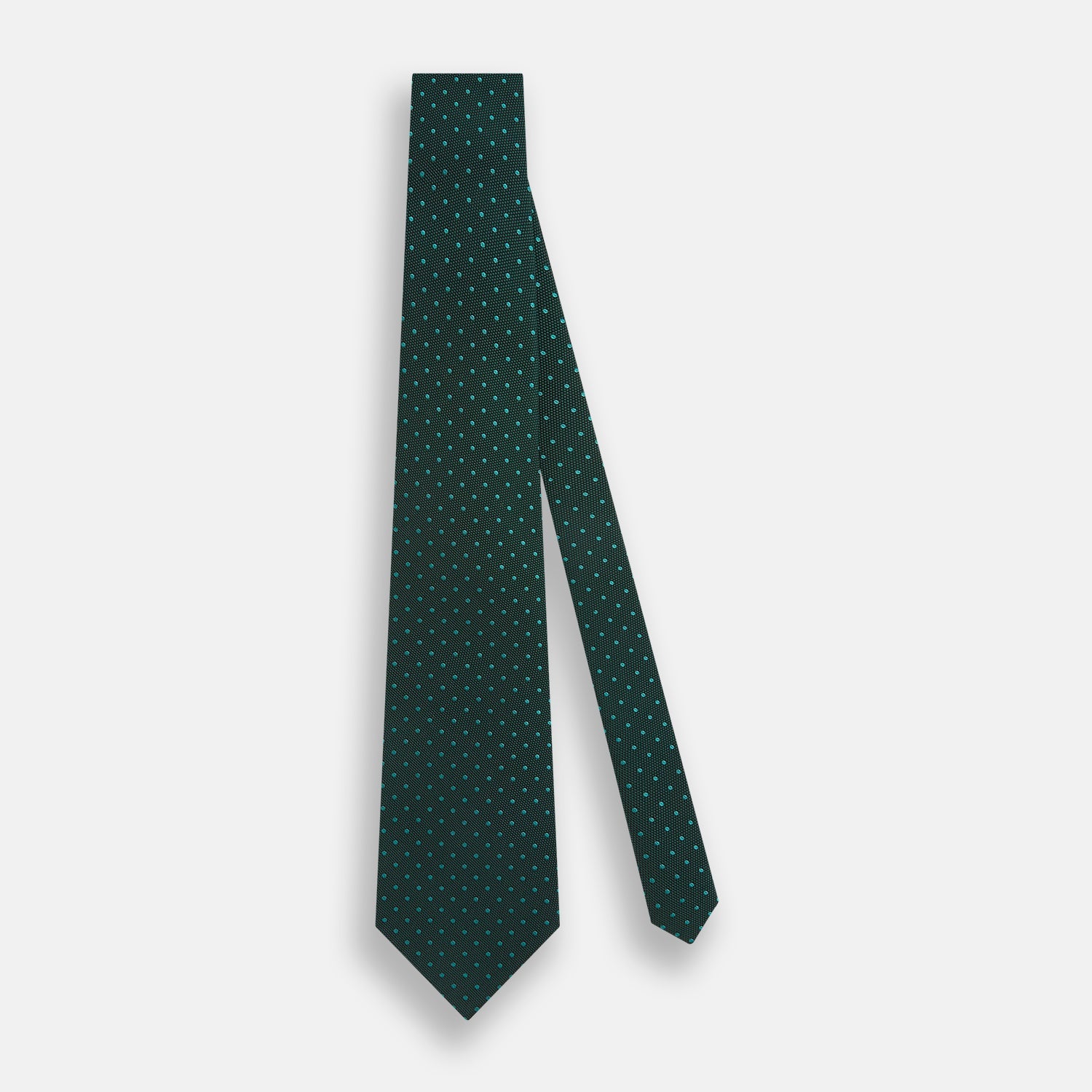 View 2 of product The Turnbull & Asser Dark Green Micro Dot Silk Tie features a refined pattern of light blue micro dots, making it the perfect accessory for any occasion.
