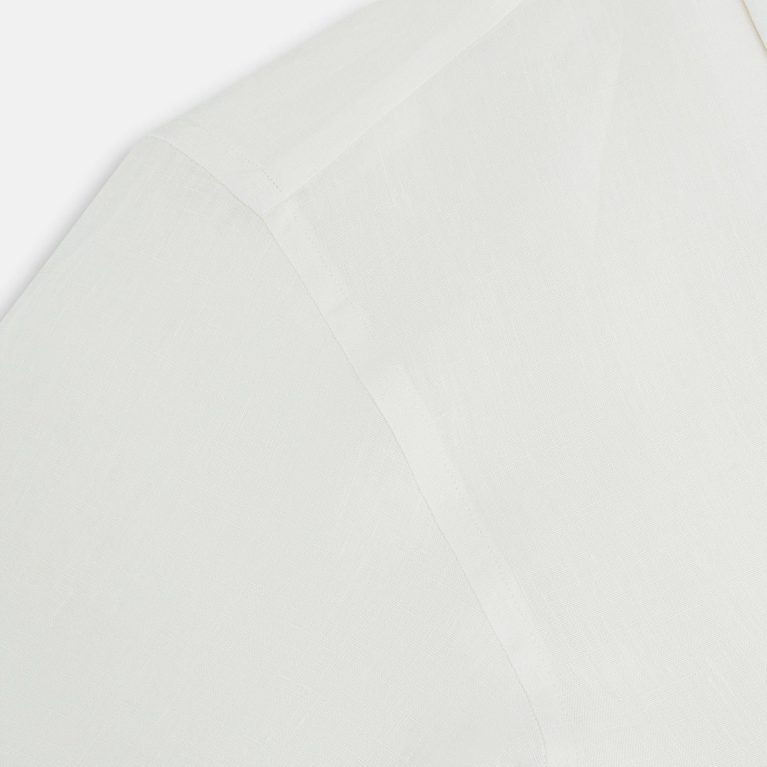 View 6 of product The Vanilla Linen Westminster Shirt by Turnbull & Asser is a long-sleeve, white button-up with a Turnbull collar, buttoned cuffs, and straight hem, highlighting British craftsmanship against a plain white background.