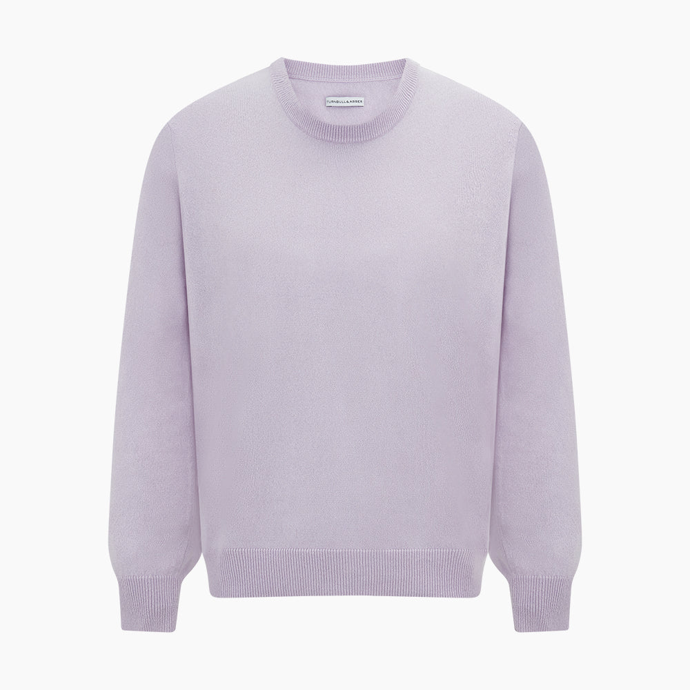 The Turnbull & Asser Lilac Cashmere Round Neck Jumper for men features long sleeves with ribbed cuffs and hem, offering a stylish, refined look. Shown against a white background.