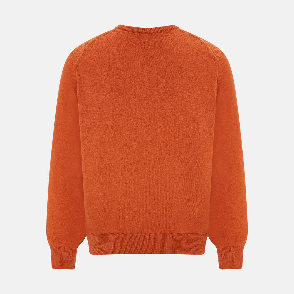 The Turnbull & Asser Rust Cashmere V-neck Jumper features long sleeves, ribbed cuffs and hem, and is shown against a plain white background.