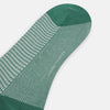 View 3 of product The Turnbull & Asser Ivory Houndstooth Mid-Length Sock features a green and white houndstooth pattern with solid green cuff, heel, and toe accents. Displayed on a plain white background.