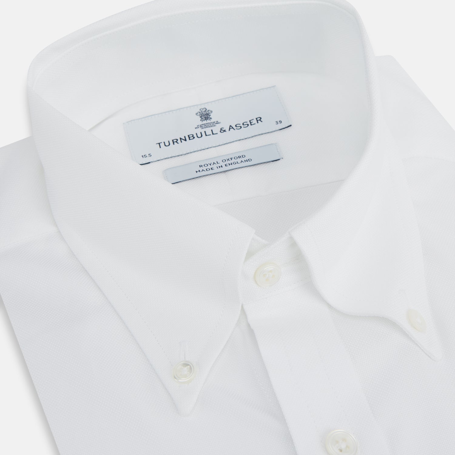 View 2 of product The Turnbull & Asser White Royal Oxford Cotton Shirt features a button-down collar and 3-button cuffs, ideal for minimalist looks, displayed on a white background.