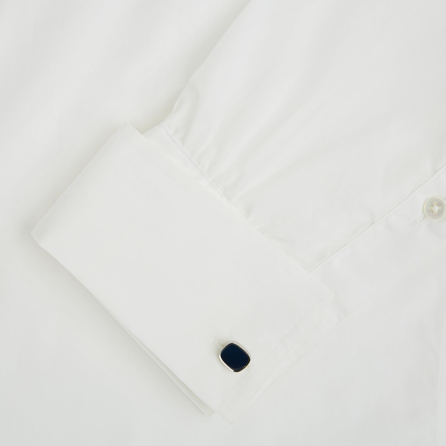 View 3 of product Turnbull & Asser Navy Rounded Square Cufflinks, crafted in sterling silver with navy faces, are stylish formal accessories shown against a white background.