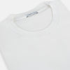 View 2 of product The Turnbull & Asser White Long-Sleeve T-shirt for men is a plain crew neck design with no logos or patterns, displayed flat on a white background.