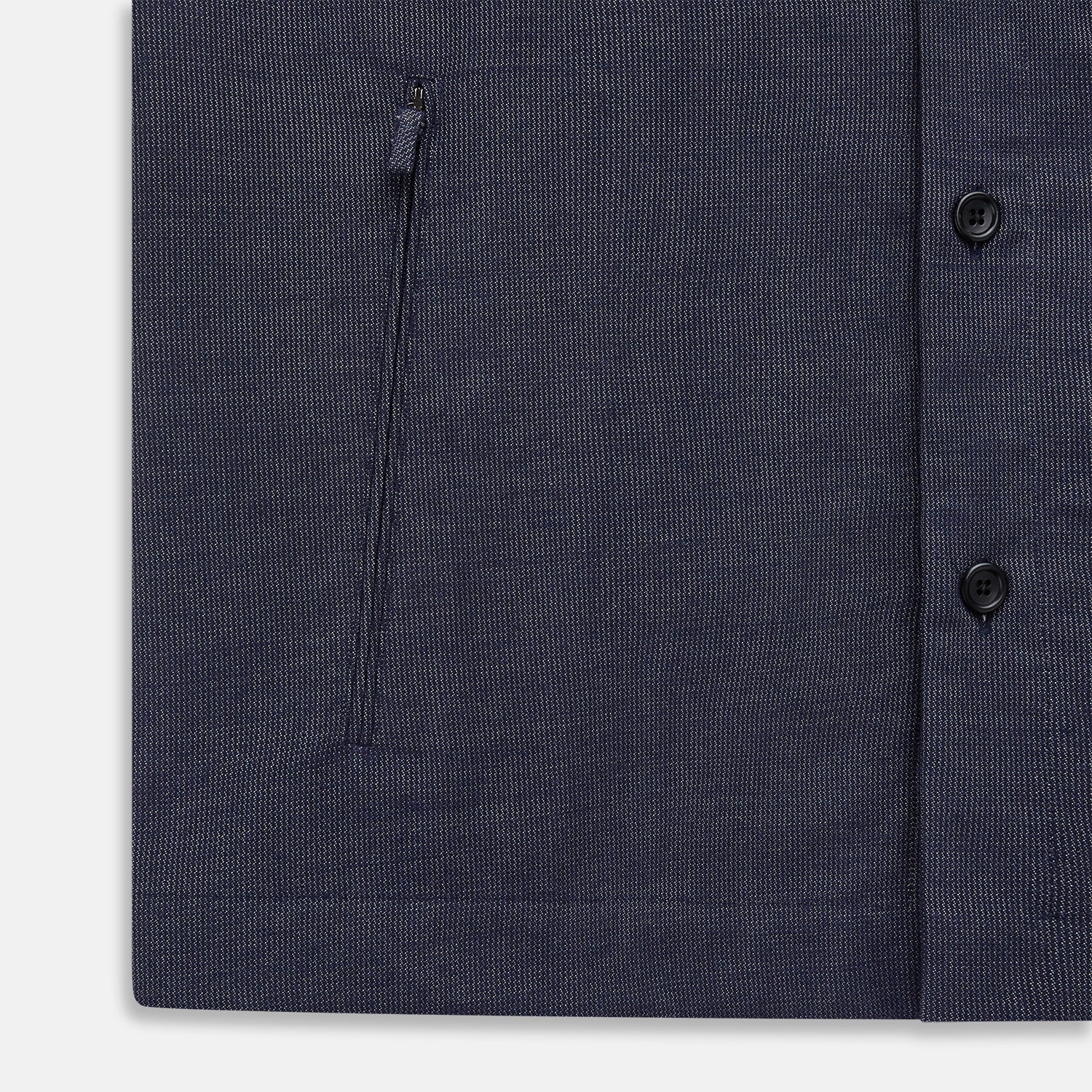 View 7 of product The Turnbull & Asser Navy Hampstead Overshirt features a collar, left chest pocket, two zippered pockets near the bottom, and a classic long-sleeve button-up design, shown laid flat on a white background.