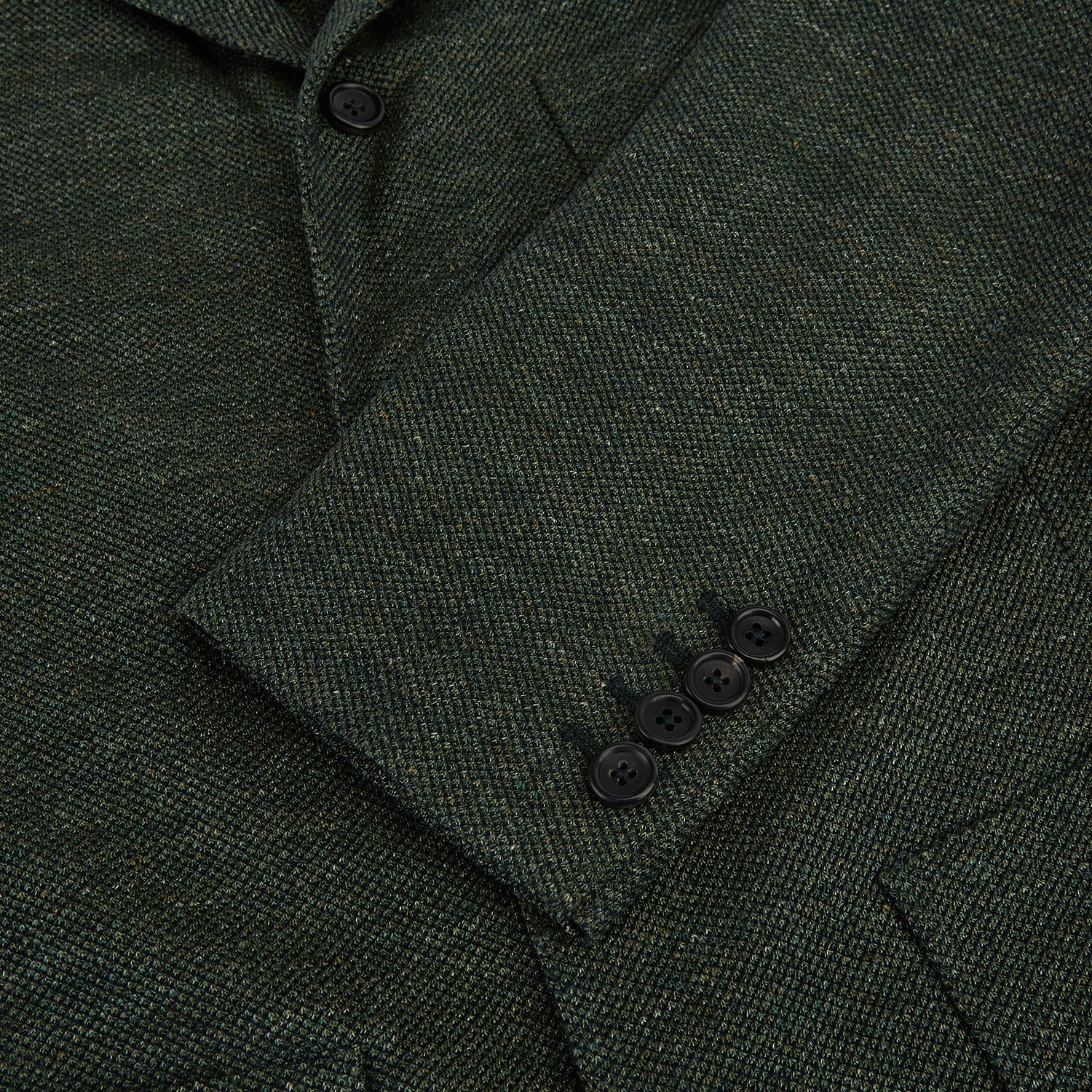 View 4 of product The Turnbull & Asser Forest Green Linen Blend Cambridge Blazer features British tailoring with notch lapels, two front buttons, a chest pocket, and two lower pockets, displayed on a plain white background.