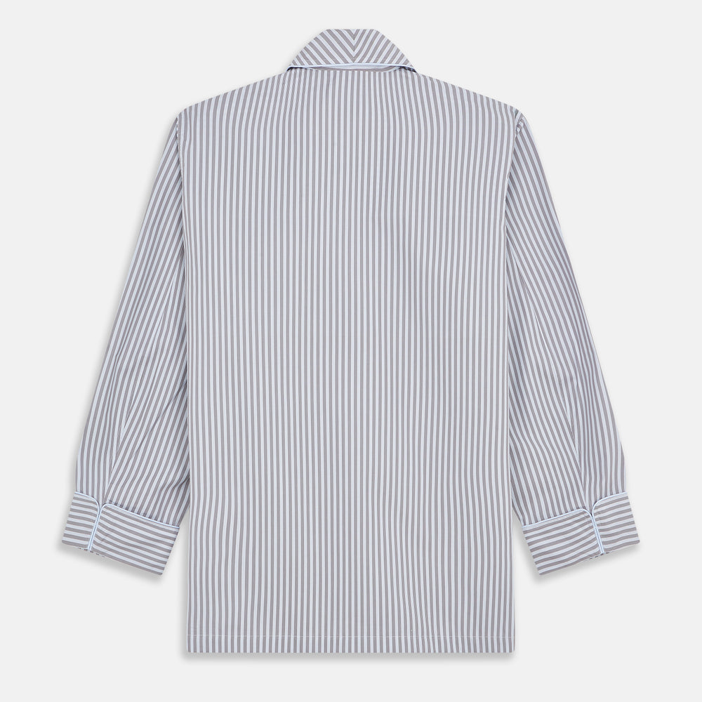 The Turnbull & Asser Pale Blue Multi Stripe Cotton Quin Pyjamas, featuring a long-sleeve button-up top and matching adjustable tie-waist pants, are neatly arranged on a white background.