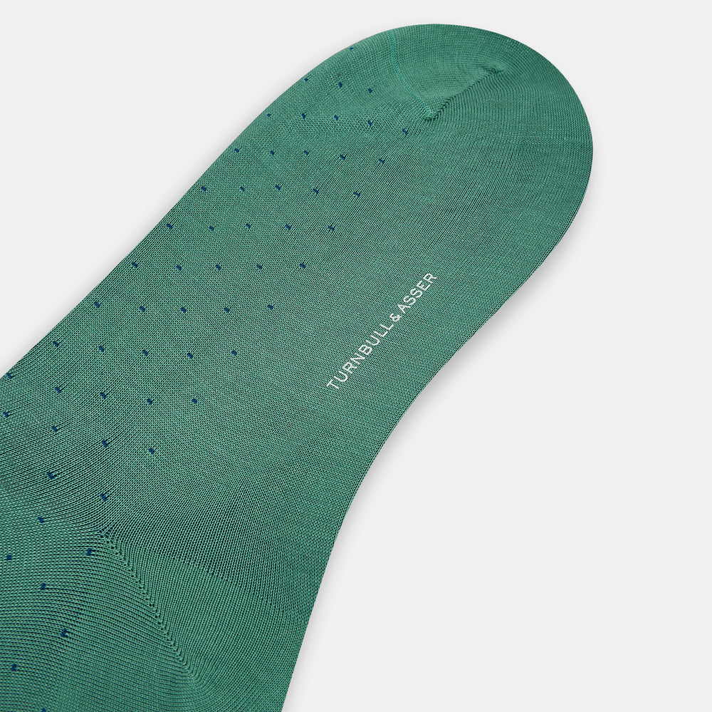 Turnbull & Asser's Forest Green/Navy Polka Dot Long Sock, made from mercerised Egyptian cotton, features a subtle dotted pattern and is shown against a plain white background.