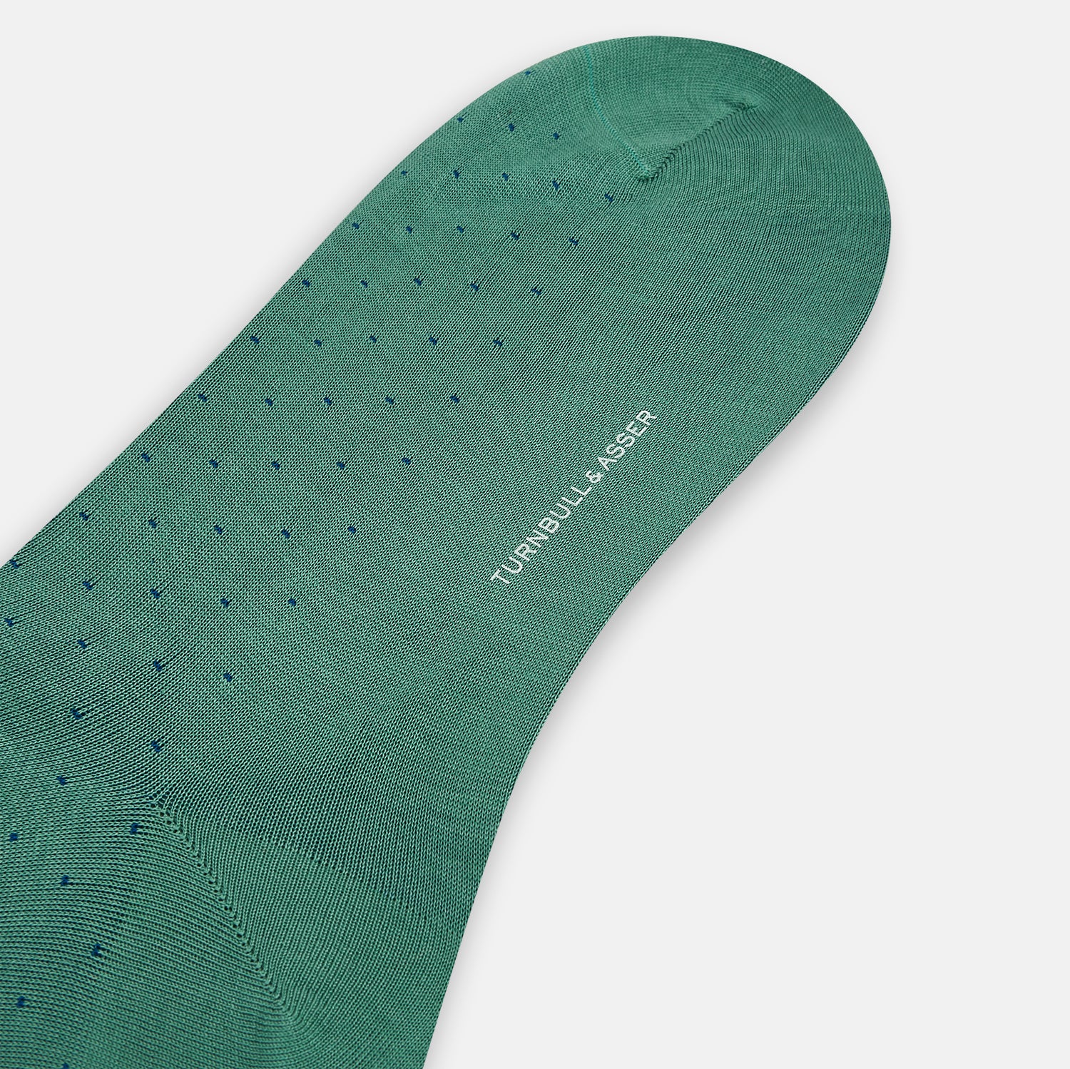 View 3 of product Turnbull & Asser's Forest Green/Navy Polka Dot Long Sock, made from mercerised Egyptian cotton, features a subtle dotted pattern and is shown against a plain white background.