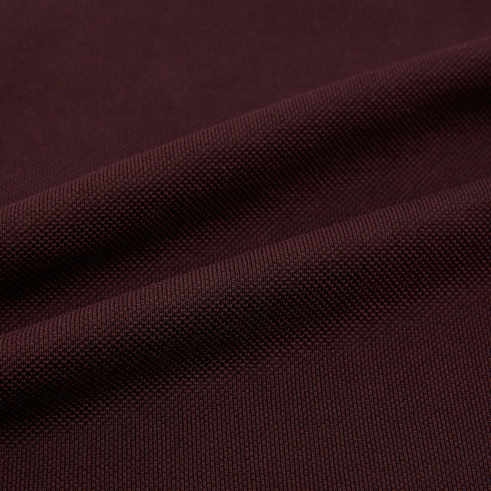 The Turnbull & Asser Burgundy Rugby Polo Shirt is a long-sleeve, pure cotton collared top with no visible buttons, shown laid flat on a white background.