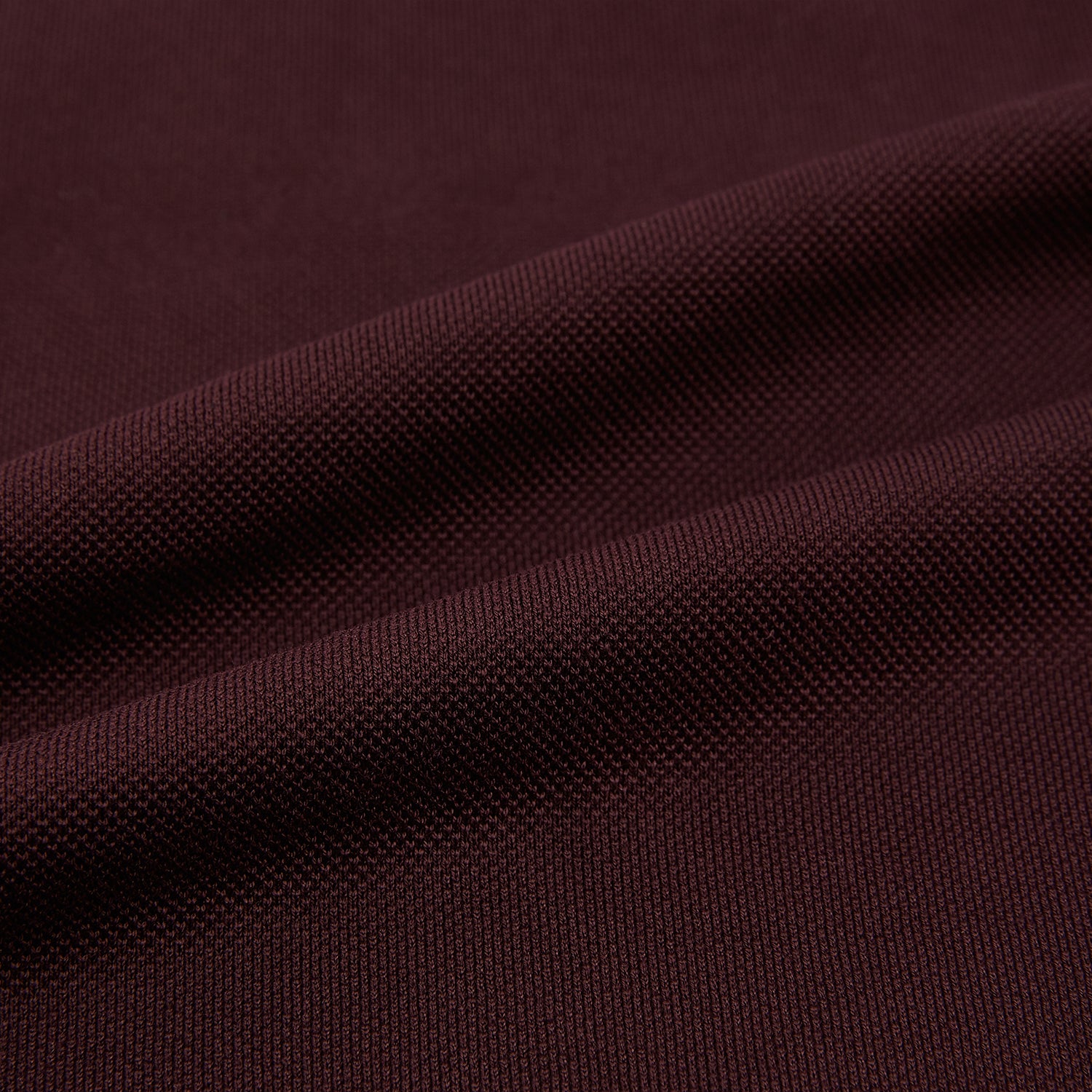 View 6 of product The Turnbull & Asser Burgundy Rugby Polo Shirt is a long-sleeve, pure cotton collared top with no visible buttons, shown laid flat on a white background.