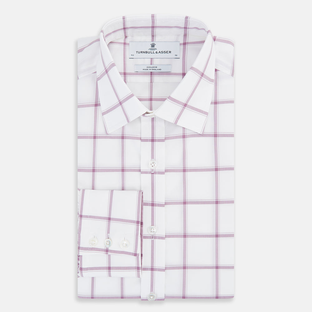 The Antique Pink Grid Check Mayfair Shirt by Turnbull & Asser is a long-sleeve shirt made from Italian cotton, featuring evenly spaced pink grid checks, displayed flat on a white background.