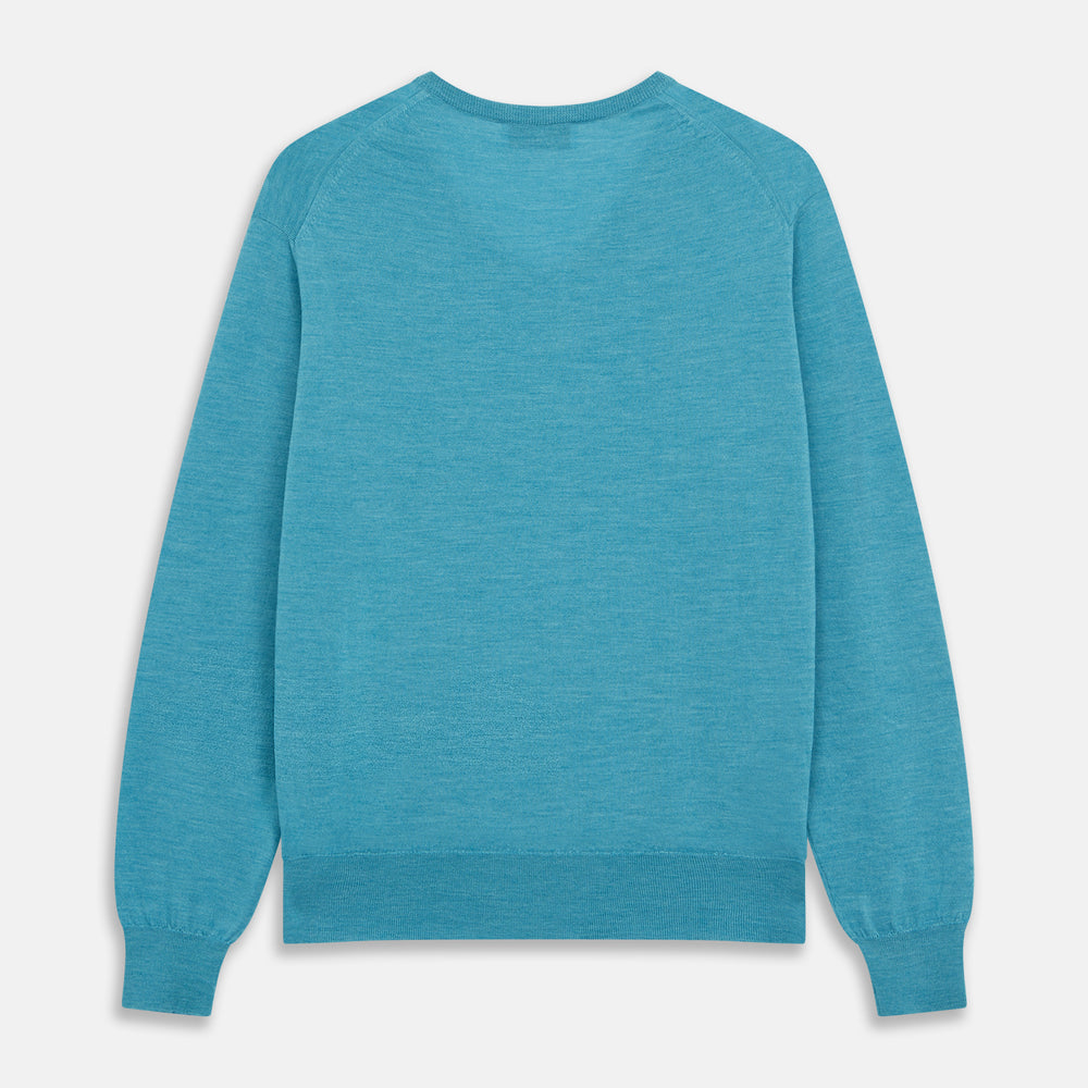 The Turquoise Kennedy Merino V-Neck Jumper by Turnbull & Asser features ribbed cuffs and hem, crafted from premium merino knitwear, and is shown flat on a white background.