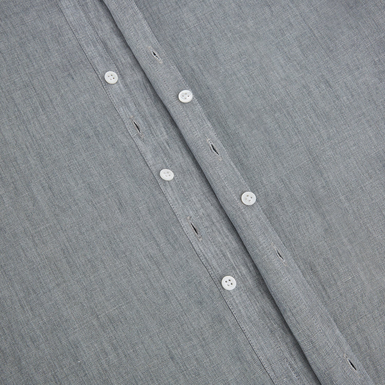 View 7 of product The Grey Linen Westminster Shirt by Turnbull & Asser is a long-sleeve, light gray button-up with a formal collar and white buttons, highlighting British craftsmanship and laid flat on a white background.