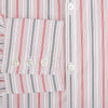 View 4 of product The Red Multi Pencil Stripe Windsor Shirt by Turnbull & Asser features long sleeves, buttoned cuffs, a Turnbull collar, and classic British tailoring with vertical red, pink, and white stripes.