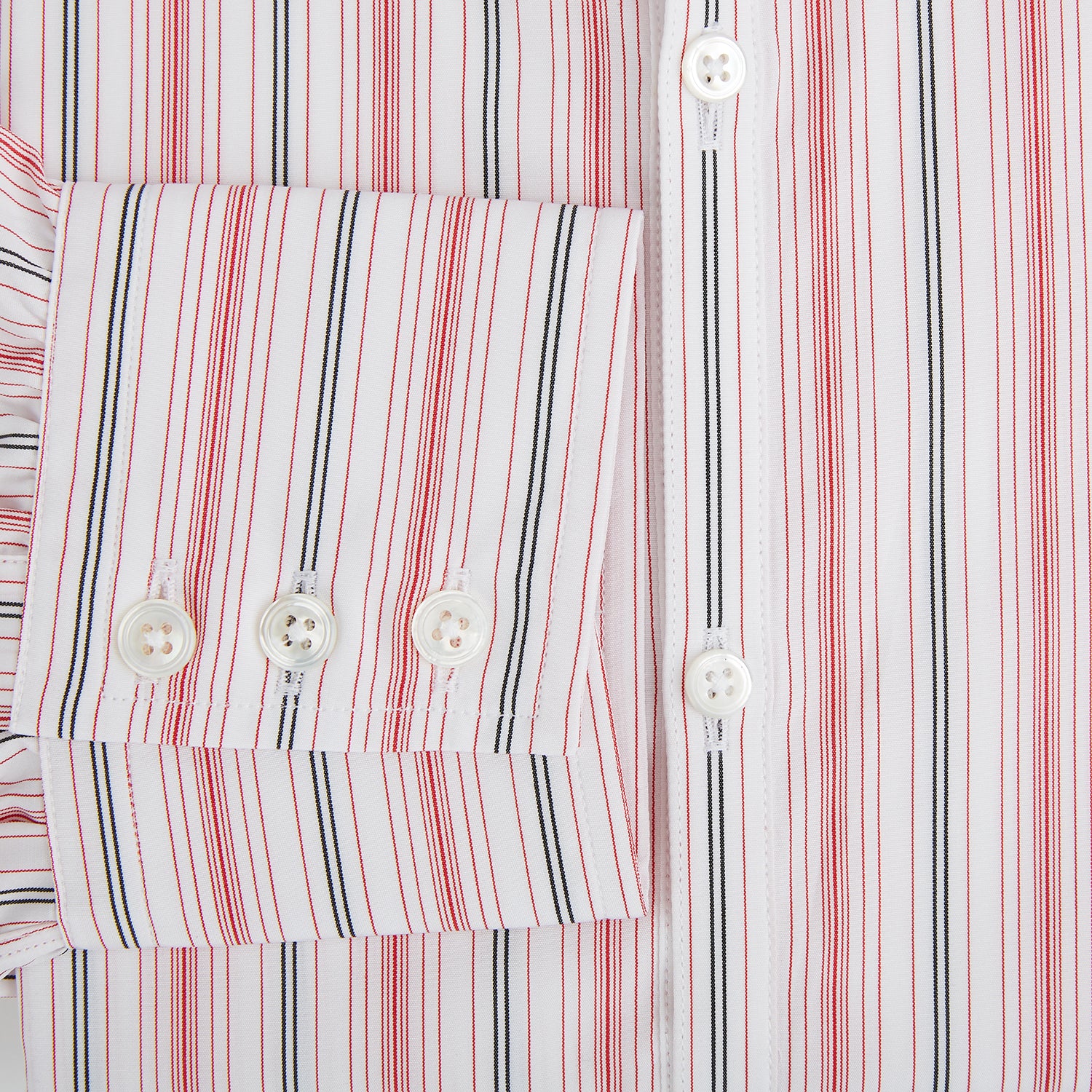 View 4 of product The Red Multi Pencil Stripe Windsor Shirt by Turnbull & Asser features long sleeves, buttoned cuffs, a Turnbull collar, and classic British tailoring with vertical red, pink, and white stripes.