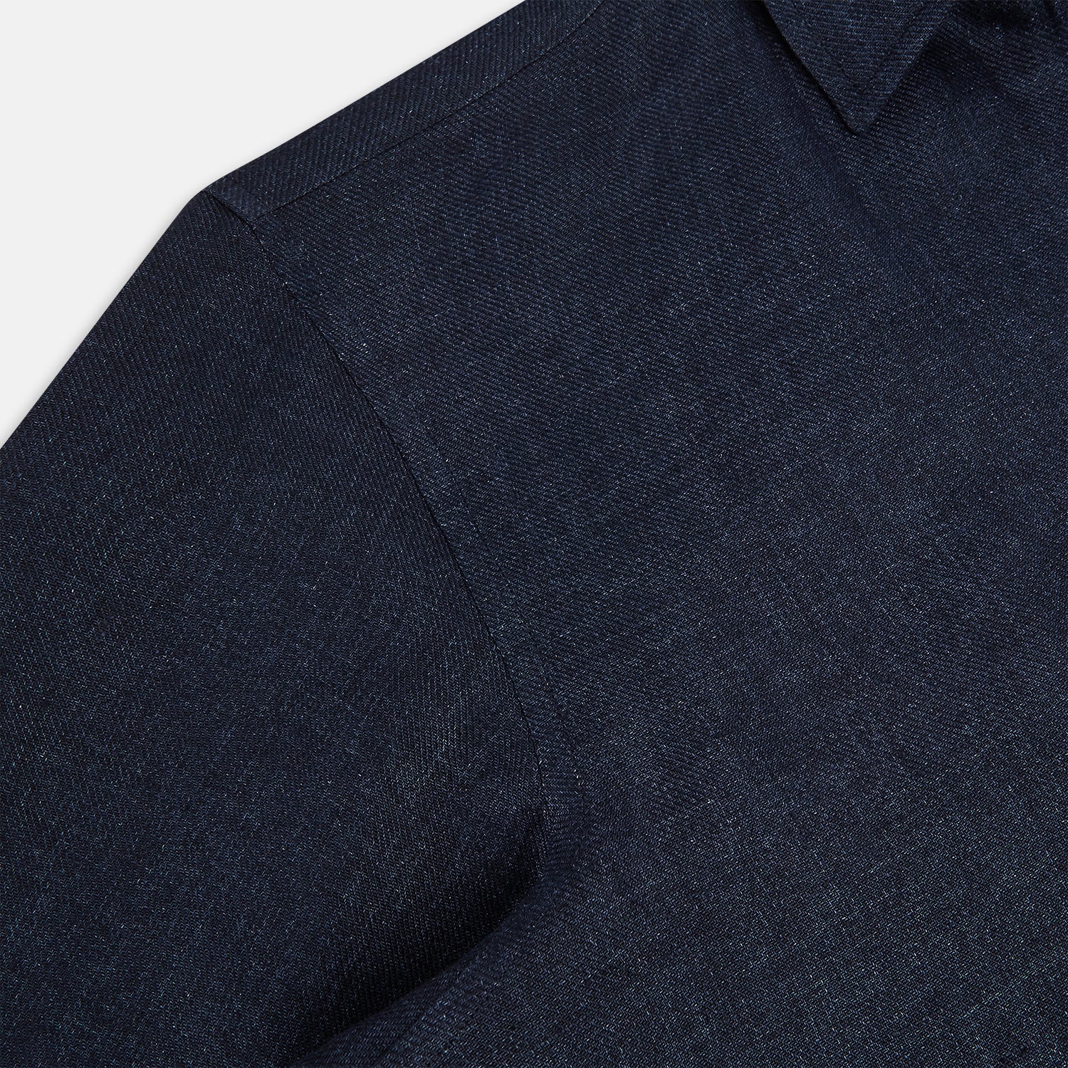 View 6 of product The Navy Linen Windsor Shirt by Turnbull & Asser features long sleeves, white buttons, a Turnbull collar, and buttoned cuffs in dark navy blue linen. Shown laid flat on a white background.