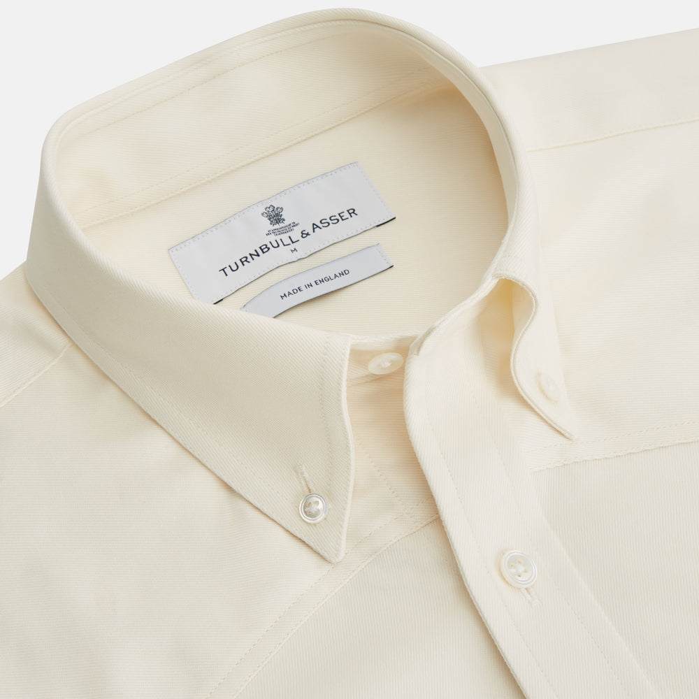 The Cream Cotton Weekend Fit Western Shirt with Dorset Collar by Turnbull & Asser features two chest pockets and is laid flat on a white background—ideal for smart-casual style.