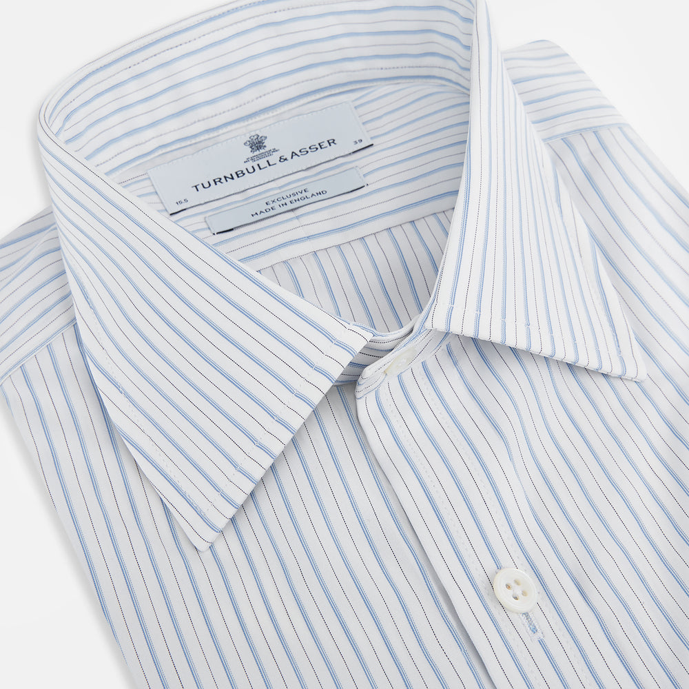 The Turnbull & Asser Sky Blue Combination Stripe Mayfair Shirt features long sleeves, a T&A collar, buttoned cuffs, and thin vertical stripes in blue, shown on a plain white background.