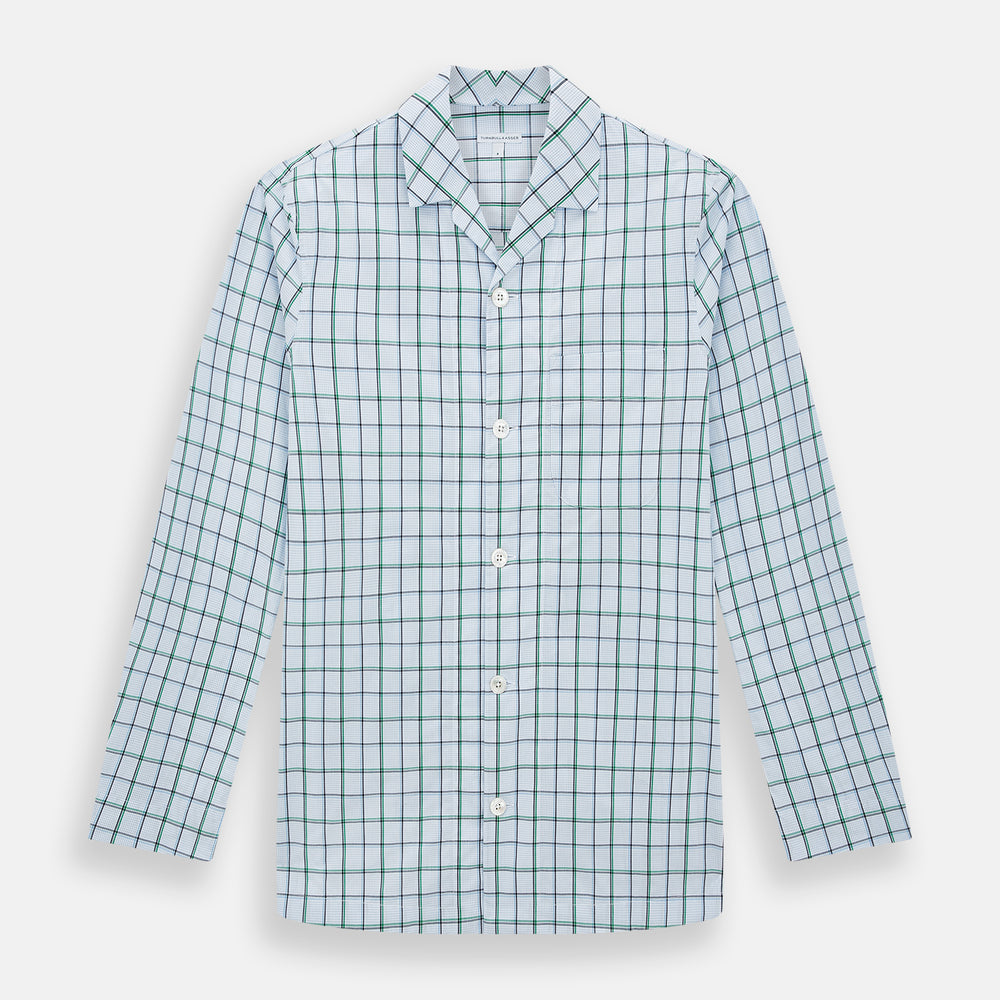 The Turnbull & Asser Green and Blue Check Pyjama Shirt features long sleeves and a button-up design on a white base, offering elegant loungewear style. Shown laid flat against a white background.