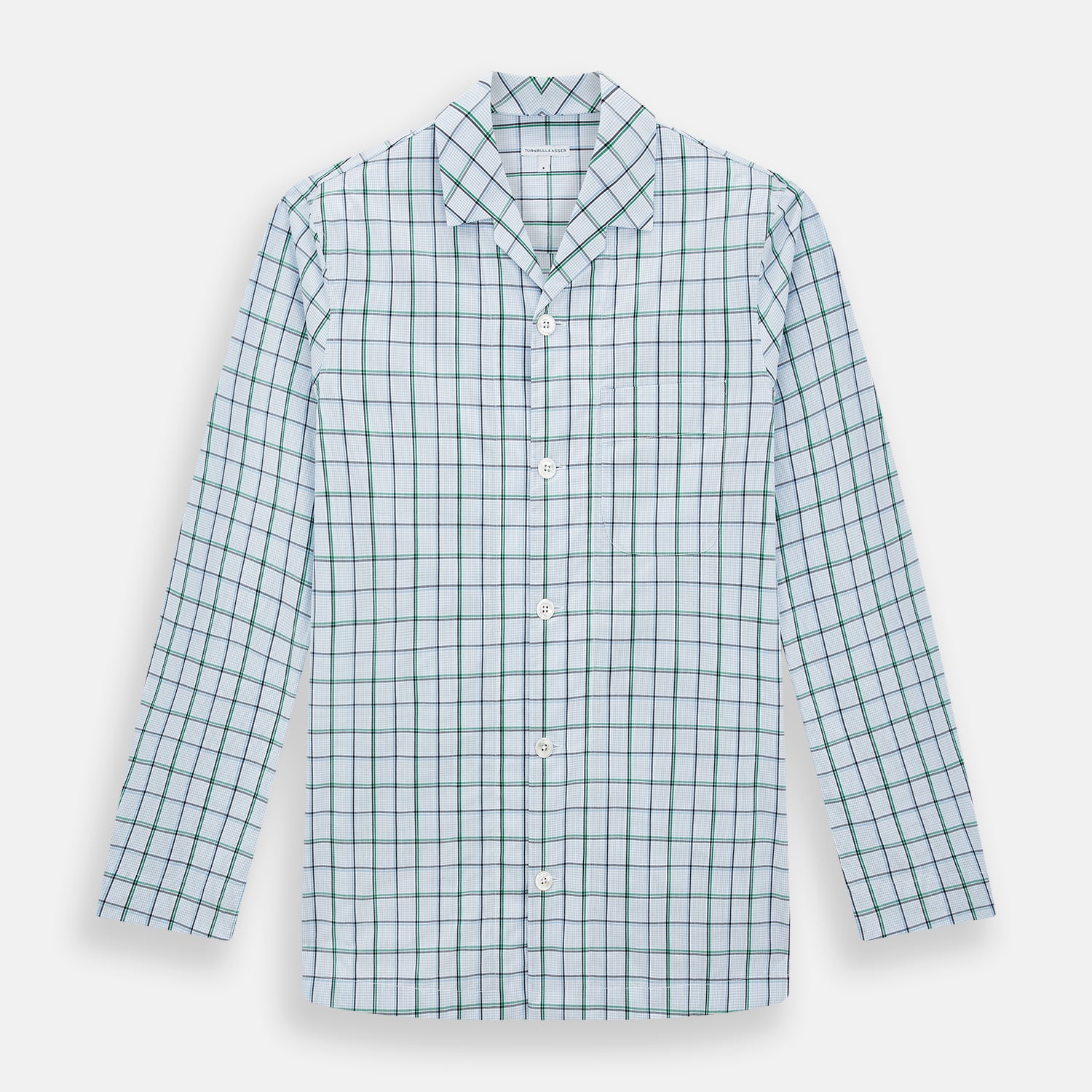 View 1 of product The Turnbull & Asser Green and Blue Check Pyjama Shirt features long sleeves and a button-up design on a white base, offering elegant loungewear style. Shown laid flat against a white background.
