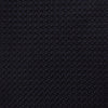 View 3 of product The GRENADINE NAVY TIE by Turnbull & Asser—a rolled, dark navy blue textured tie—serves as an essential accessory for smart outfits, shown against a plain white background.