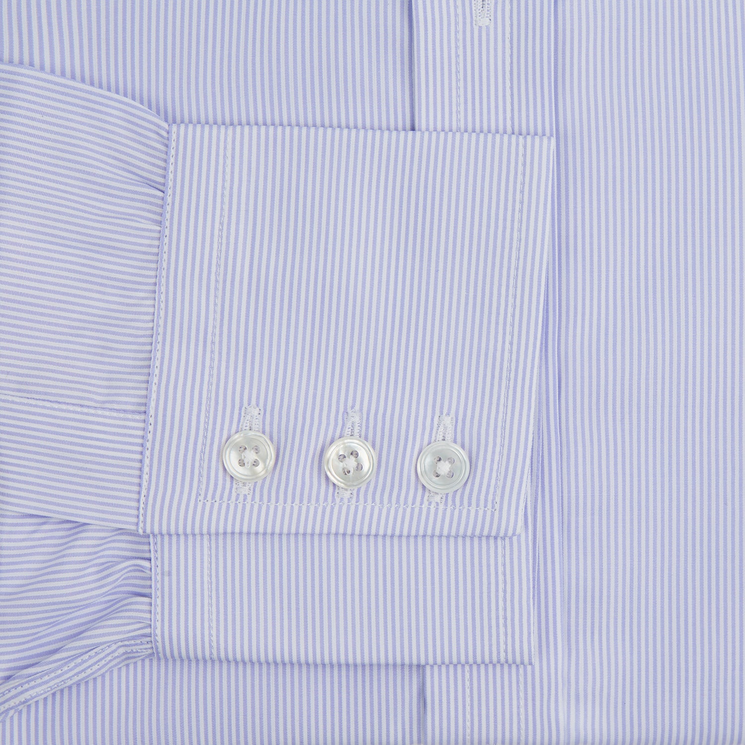 View 4 of product A Blue and White Fine Bengal Stripe Sea Island Quality Cotton Shirt by Turnbull & Asser, featuring a T&A collar and 3-button cuffs, is laid flat on a white background.
