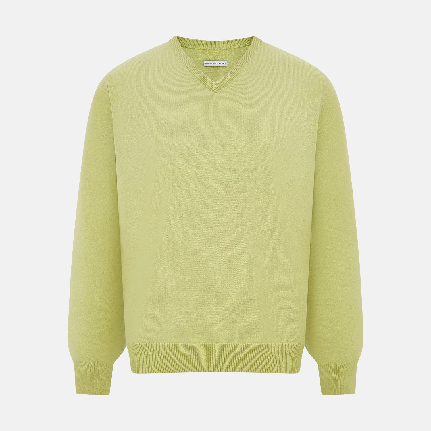View 1 of product The Turnbull & Asser Melon Green Cashmere V-Neck Jumper features long sleeves with ribbed cuffs and hem, shown against a plain white background.