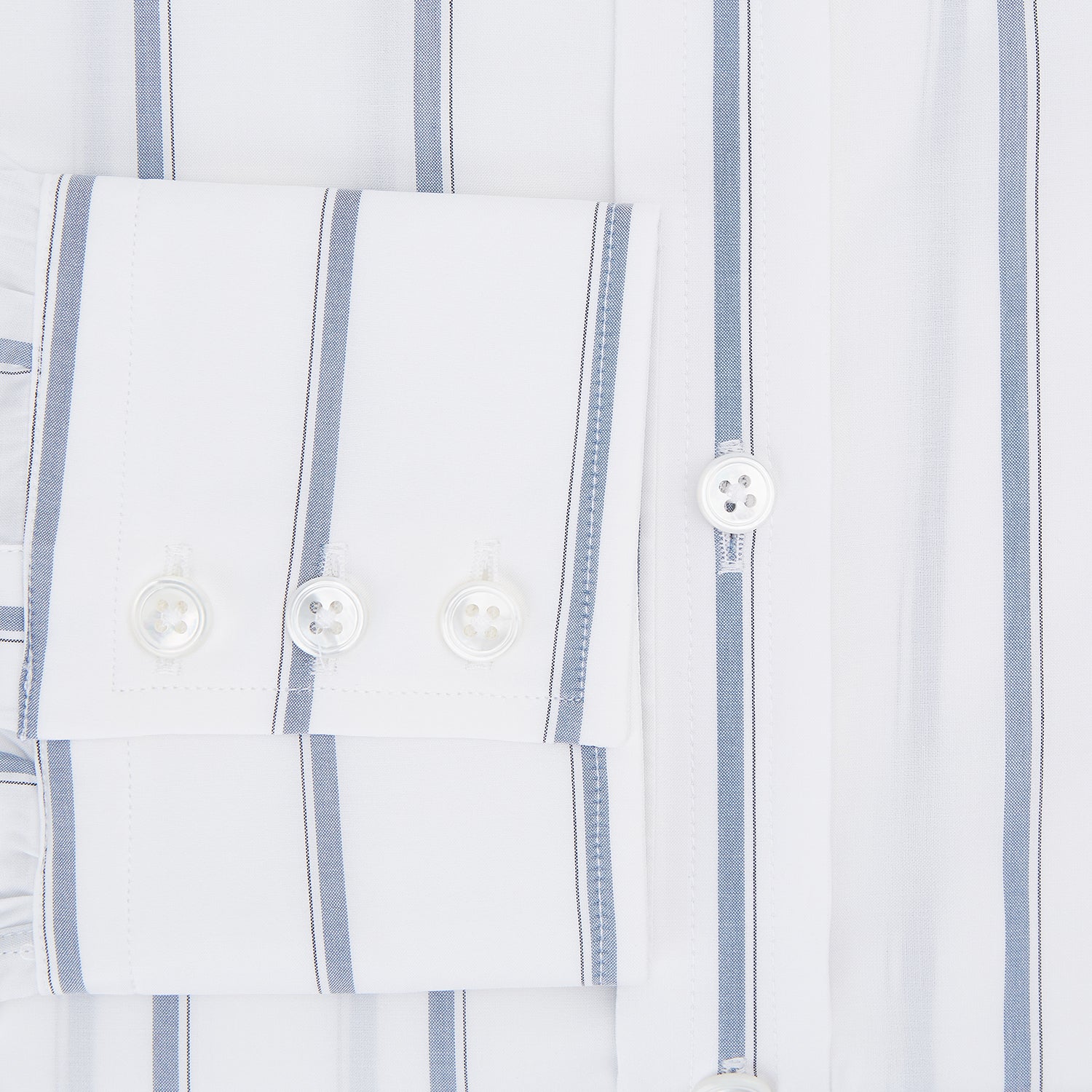 View 4 of product The Turnbull & Asser Steel Grey Track Stripe Mayfair Shirt is a long-sleeve Italian cotton shirt with vertical stripes, a button-down front, and classic collar, shown laid flat on a white background.