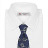 View 2 of product The Turnbull & Asser Navy Jacquard Silk Floral Tie features white and light blue abstract leaf designs, exemplifying fine British craftsmanship. Shown rolled up against a white background.