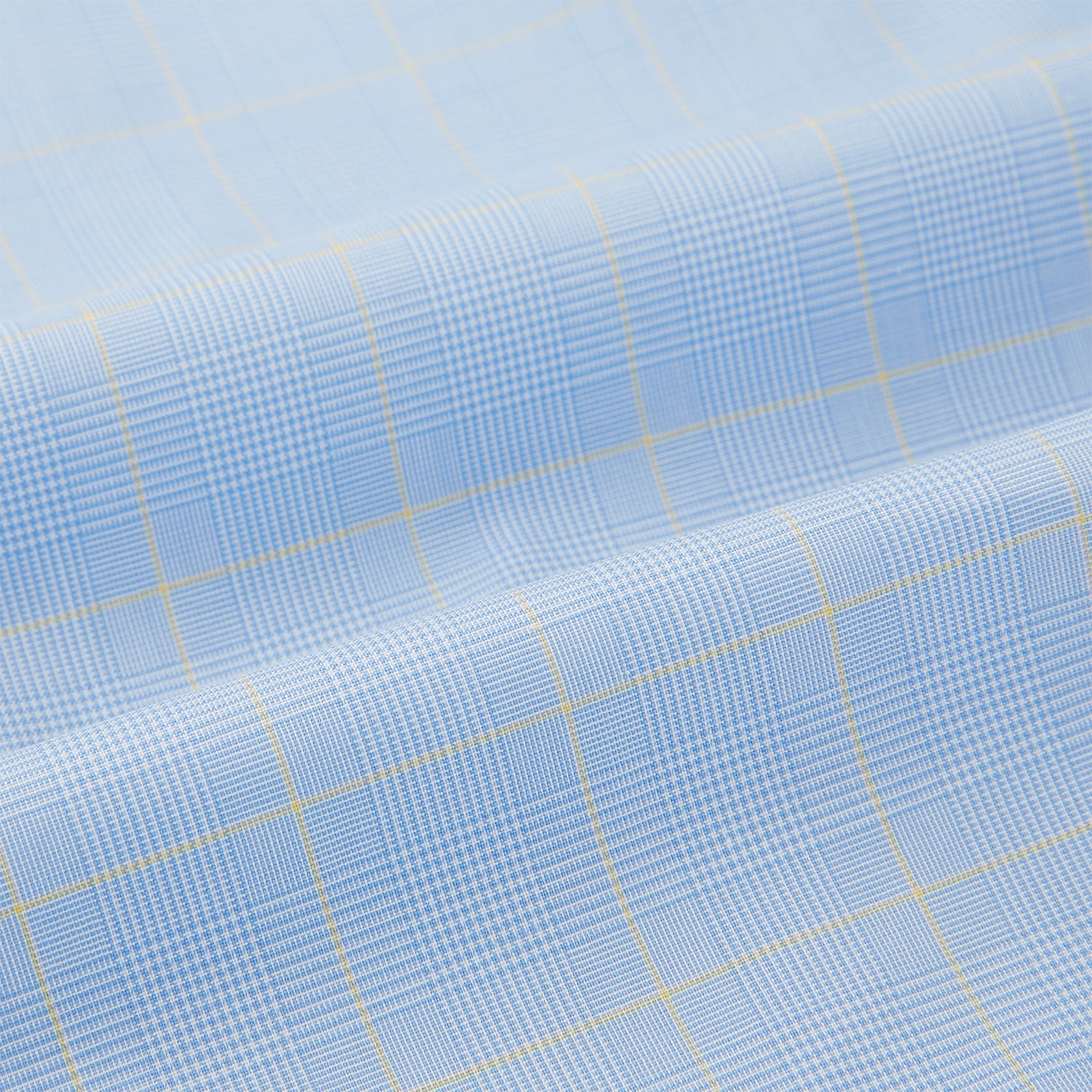 View 6 of product The Turnbull & Asser Blue Prince of Wales Check Pyjama Shirt features long sleeves, a notched collar, a left chest pocket, and a subtle check pattern, shown laid flat on a white background.