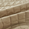 View 4 of product The Turnbull & Asser Sand Double-Breasted Quilted Gilet features a sleeveless design, brown buttons, slanted chest pocket, and two zippered side pockets—perfect for modern layered dressing. Shown on a plain white background.