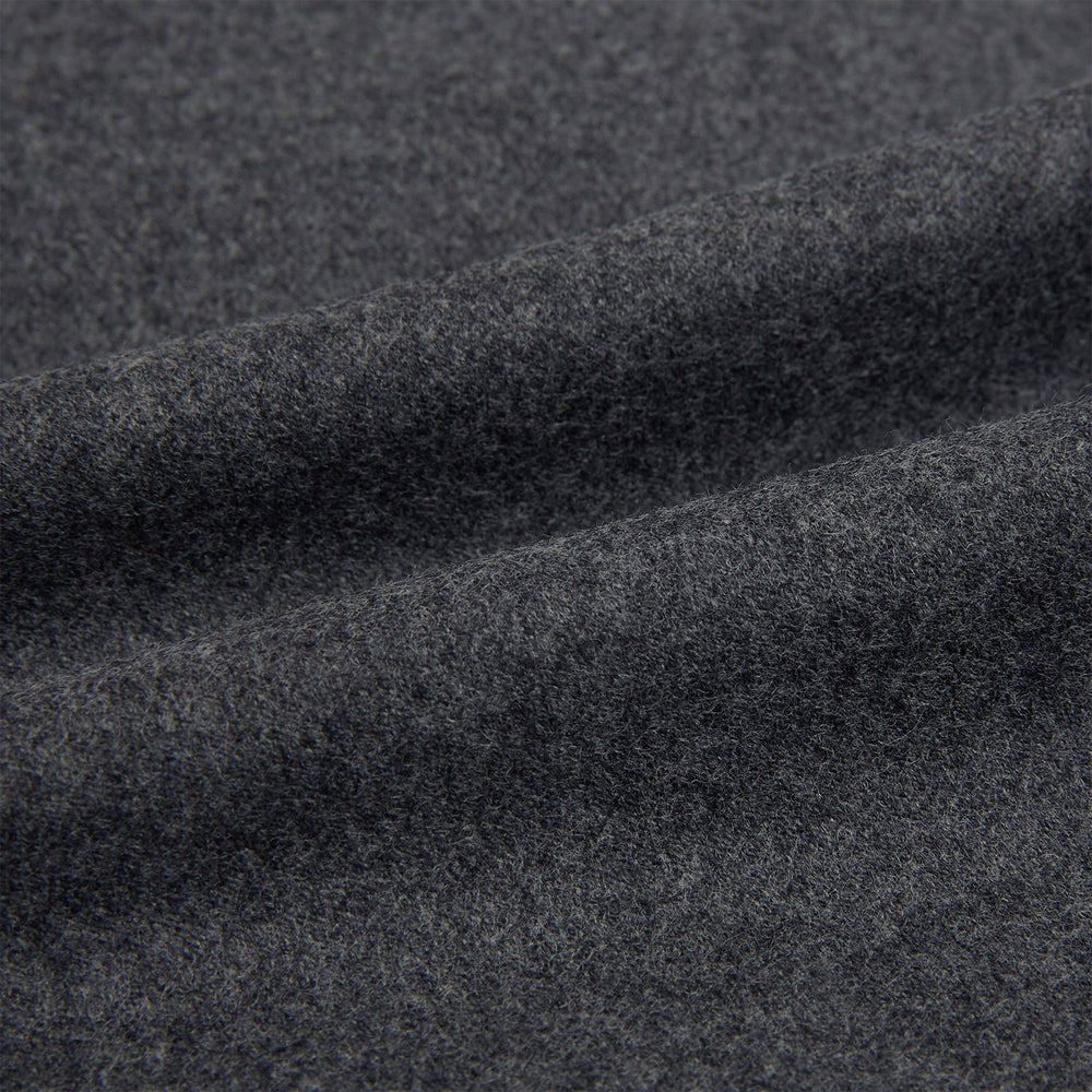 The Grey Highbury Overshirt by Turnbull & Asser is a long-sleeve, button-up charcoal gray overshirt with a single chest pocket, inspired by classic formal jackets and shown laid flat on a white background.