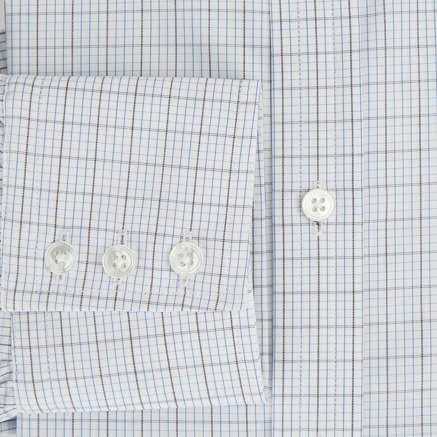 View 4 of product The Turnbull & Asser Navy and Blue Multi Grid Check Mayfair Shirt is a long-sleeve, button-up Italian cotton shirt with a collar and cuffs, featuring a blue grid check pattern, shown against a plain white background.