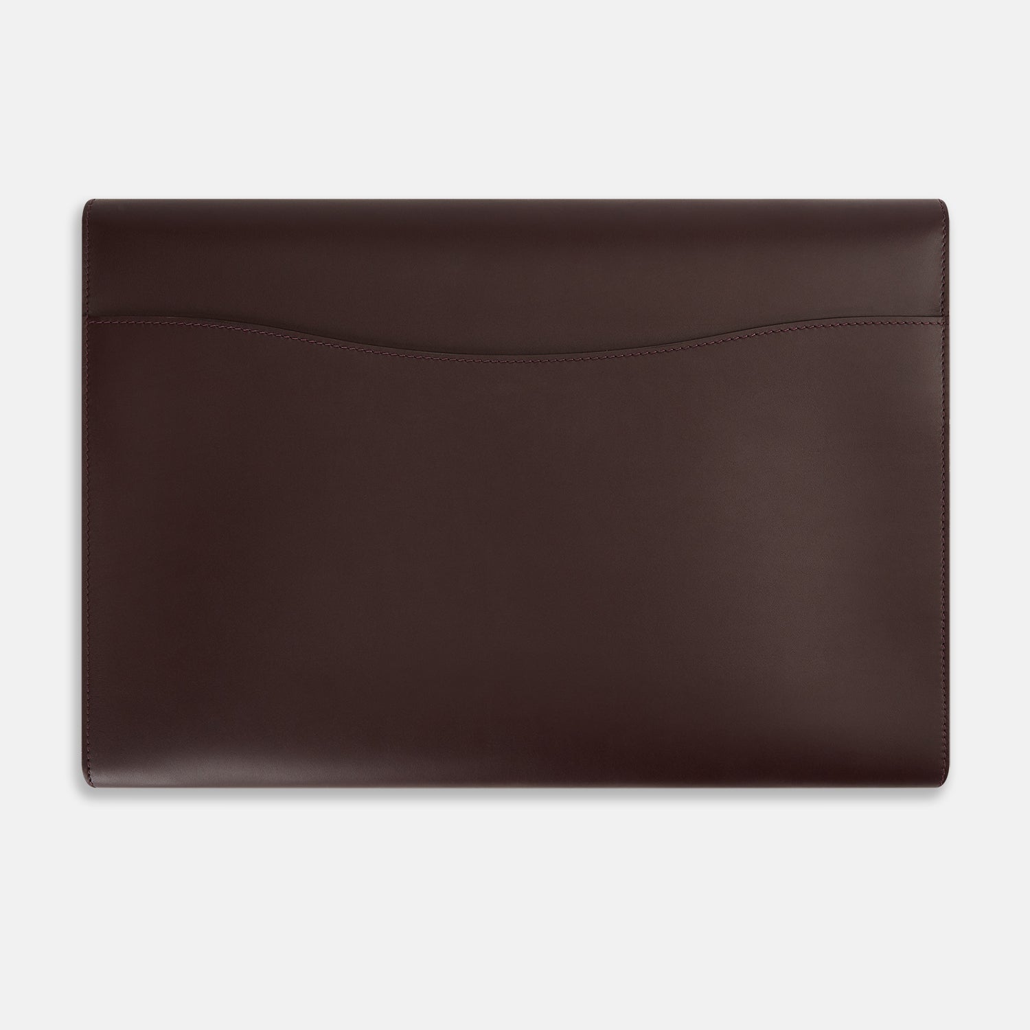 View 4 of product The Turnbull & Asser Burgundy Leather Snap-Fasten Pouch is a sleek, envelope-style laptop accessory with a smooth finish, curved flap, and elegant snap closure, ideal for business travel against a white background.