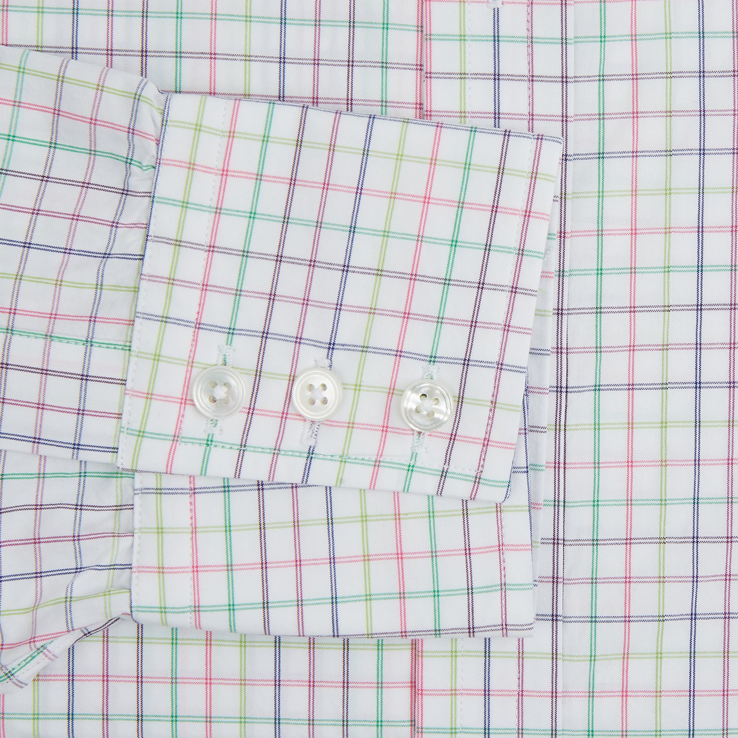 View 3 of product The Turnbull & Asser Multicoloured Double Grid Check Mayfair Shirt, made from organic cotton, features long sleeves, a collar, and a blue, green, and red grid check on white. The shirt is shown neatly laid flat against a white background.