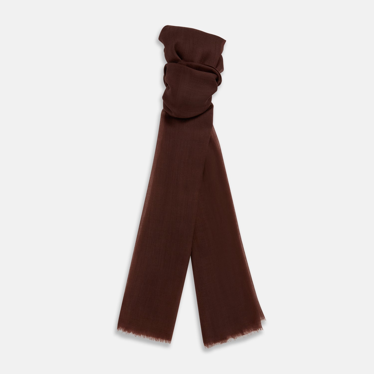 View 1 of product The Turnbull & Asser Dark Chocolate Cashmere Scarf is neatly folded with fringed edges and loose ends, showcasing its lightweight, luxurious fabric on a plain white background.