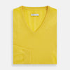 View 4 of product The Turnbull & Asser Canary Yellow Cashmere V-neck Jumper features long sleeves and ribbed cuffs and hem, shown against a white background.