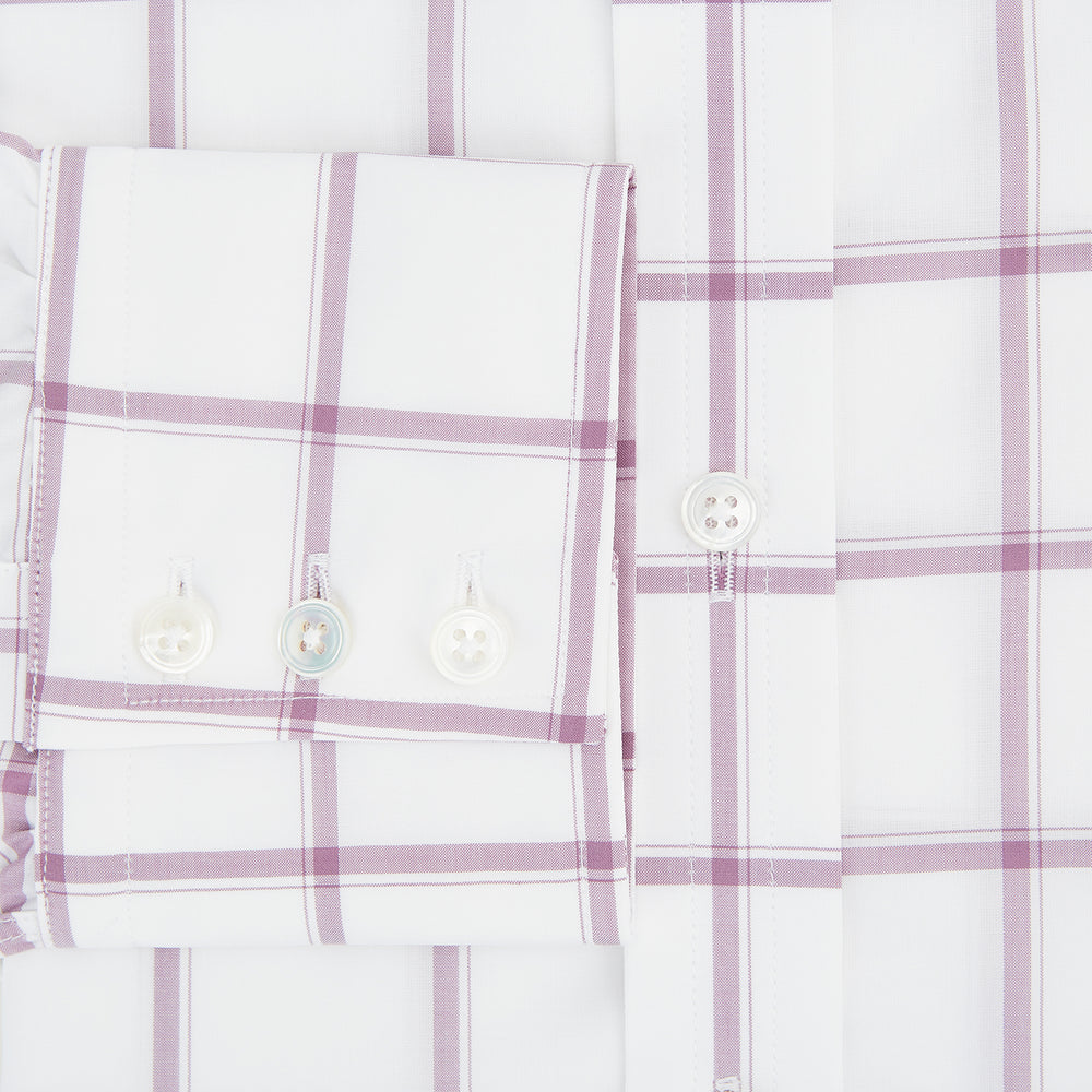 The Antique Pink Grid Check Mayfair Shirt by Turnbull & Asser is a long-sleeve shirt made from Italian cotton, featuring evenly spaced pink grid checks, displayed flat on a white background.