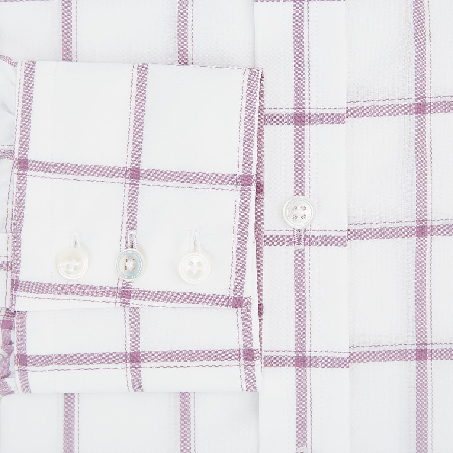 View 4 of product The Antique Pink Grid Check Mayfair Shirt by Turnbull & Asser is a long-sleeve shirt made from Italian cotton, featuring evenly spaced pink grid checks, displayed flat on a white background.